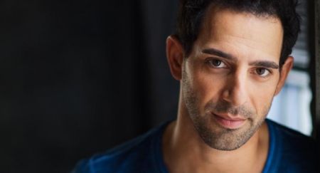 Marie-Marguerite Sabongui's brother is posing for a photo.